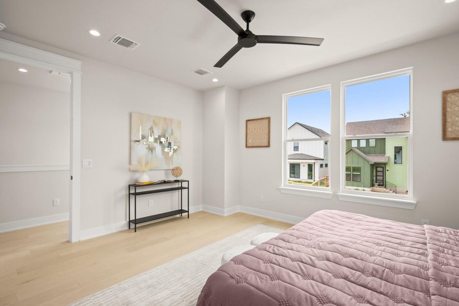 Bedroom with light wood finished floors, recessed lighting, and ceiling fan