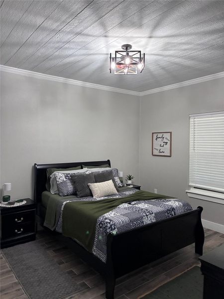 Master Bedroom with tile flooring and ornamental molding
