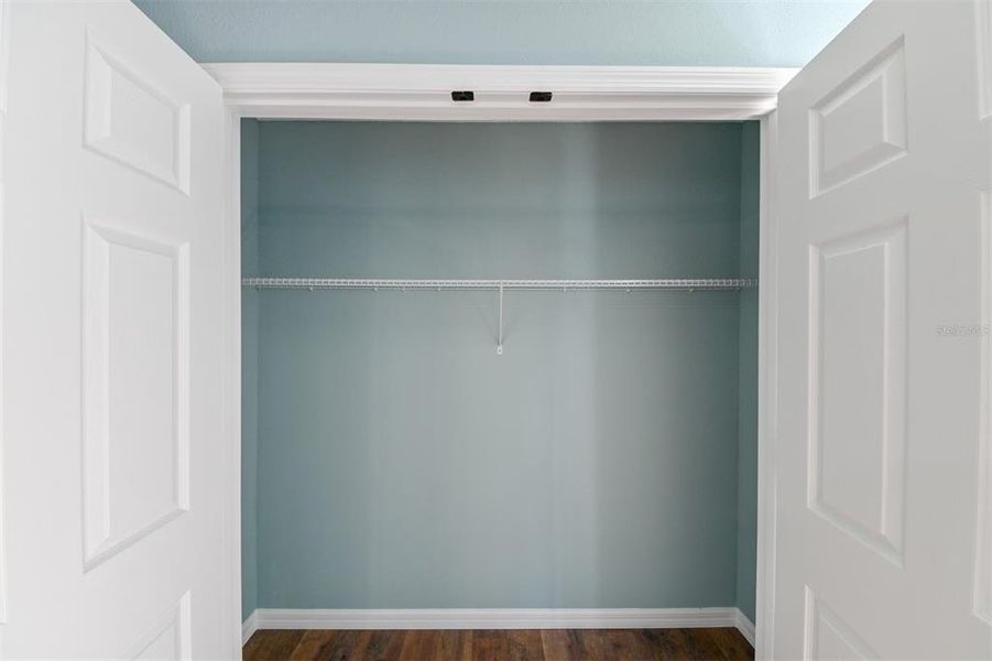 His & her closets in main / owner bedroom