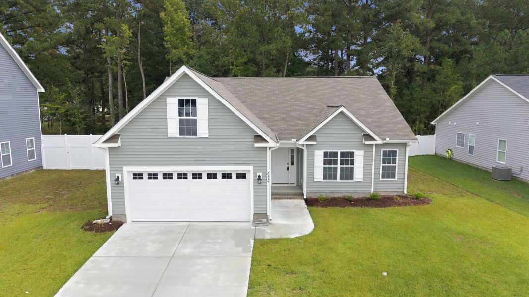 Front exterior of a new home in Davenport Farms, Winterville, NC, highlighting curb appeal (Image 19).