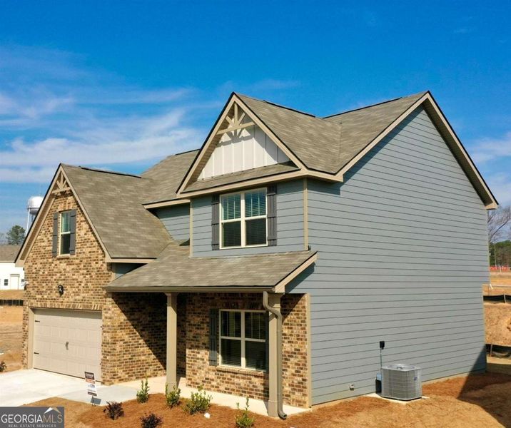 Front exterior of a new home in Garden Walk, Jackson, GA, highlighting curb appeal (Image 1).