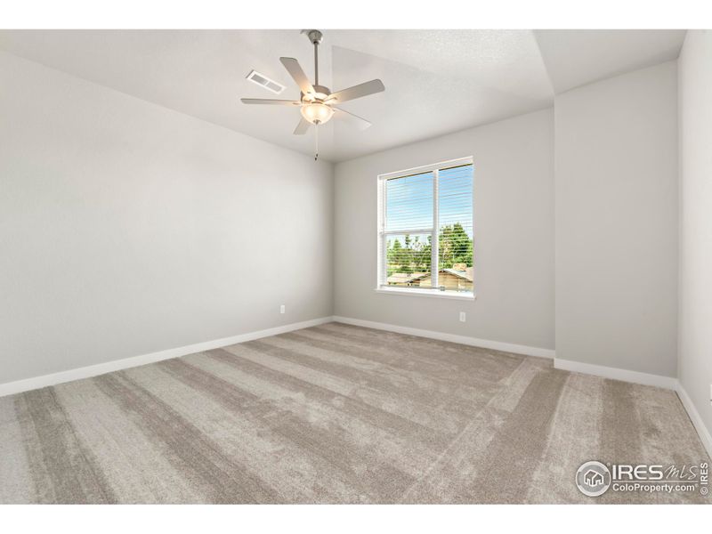 Primary bedroom w/ ceiling fan included!