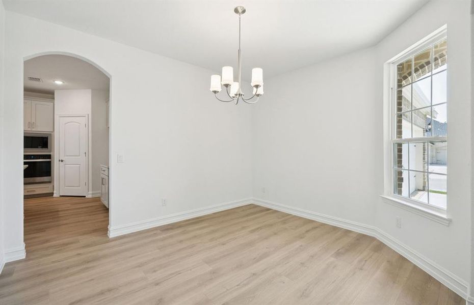 Formal dining room with large windows Formal dining room with large windows