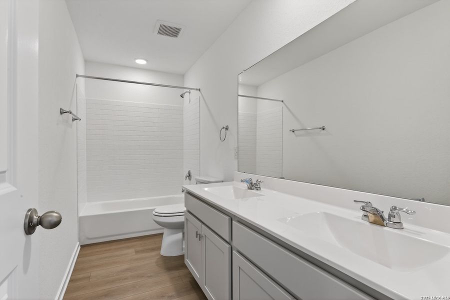 Furnished interior view inside a new home in Hennersby Hollow, San Antonio (Image 11).