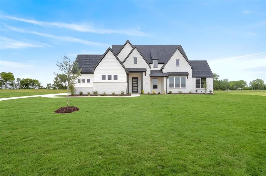 Contemporary exterior with white brick and dark trim accents Contemporary exterior with white brick and dark trim accents