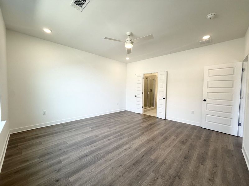 Unfurnished bedroom with recessed lighting, ceiling fan, and dark wood-style flooring