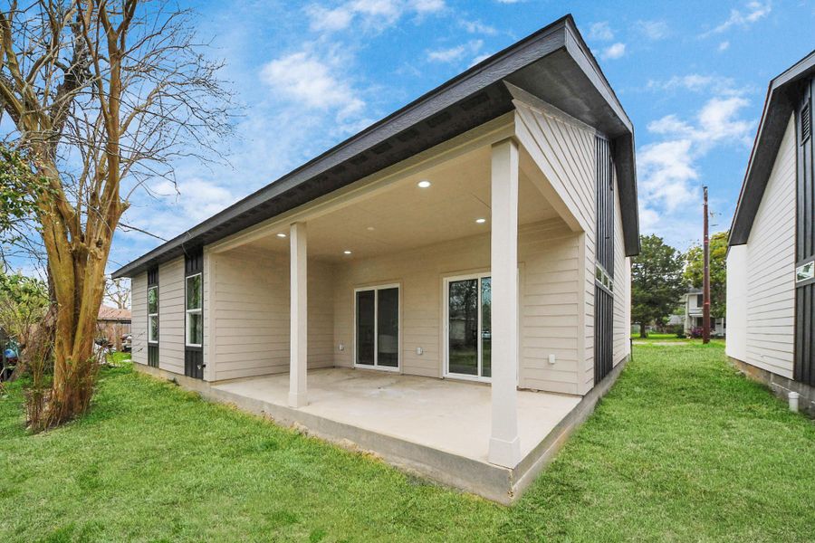 Relax on the rear covered patio—your private spot for outdoor dining