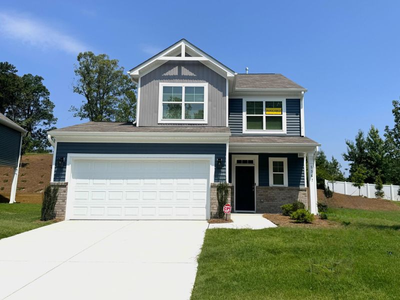 Front exterior of a new home in Chandler Ridge, McLeansville, NC, highlighting curb appeal (Image 1). Front exterior of a new home in Chandler Ridge, McLeansville, NC, highlighting curb appeal (Image 1).