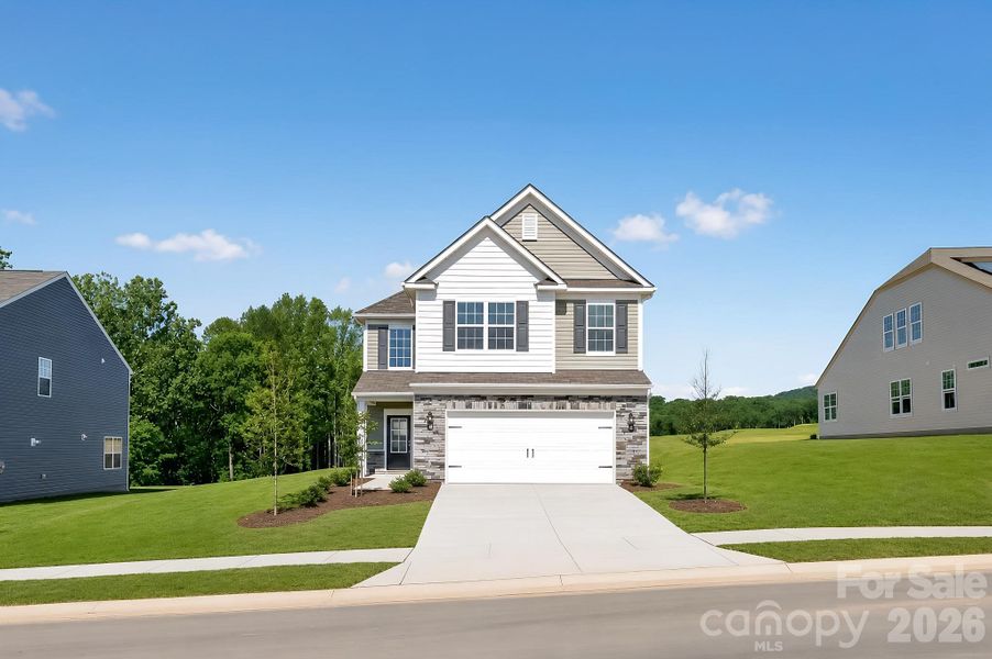 Front exterior of a new home in Shannon Woods, Maiden, NC, highlighting curb appeal (Image 16). Front exterior of a new home in Shannon Woods, Maiden, NC, highlighting curb appeal (Image 16).