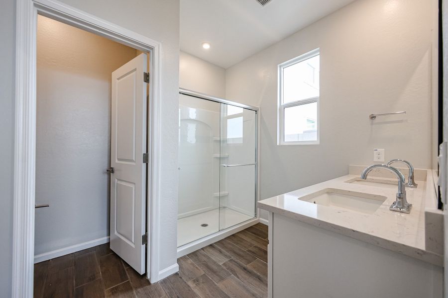 A bathroom with a glass shower.
