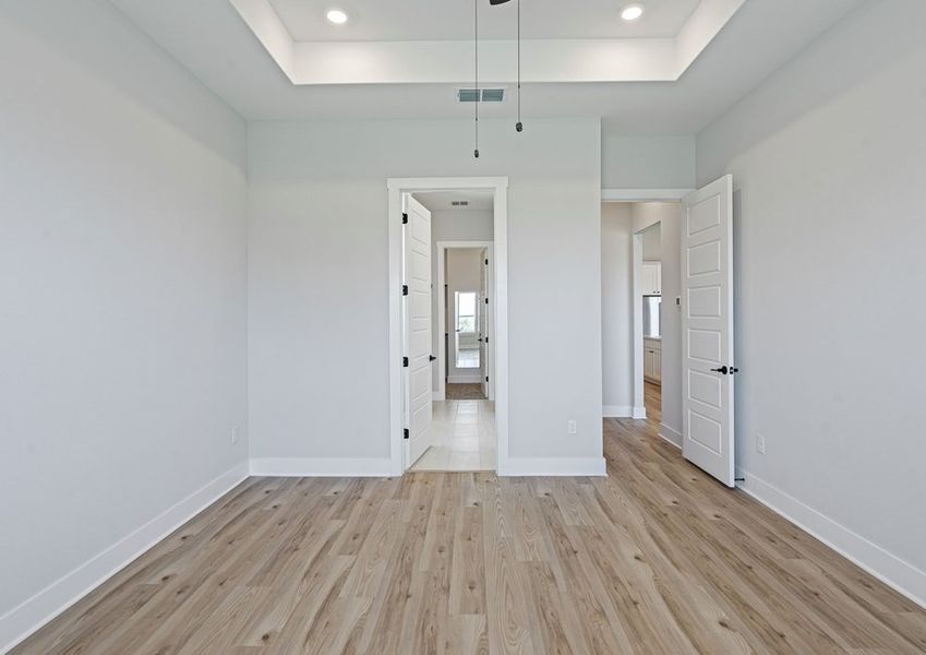 The master suite has a large bedroom, ensuite bathroom and a walk-in closet.