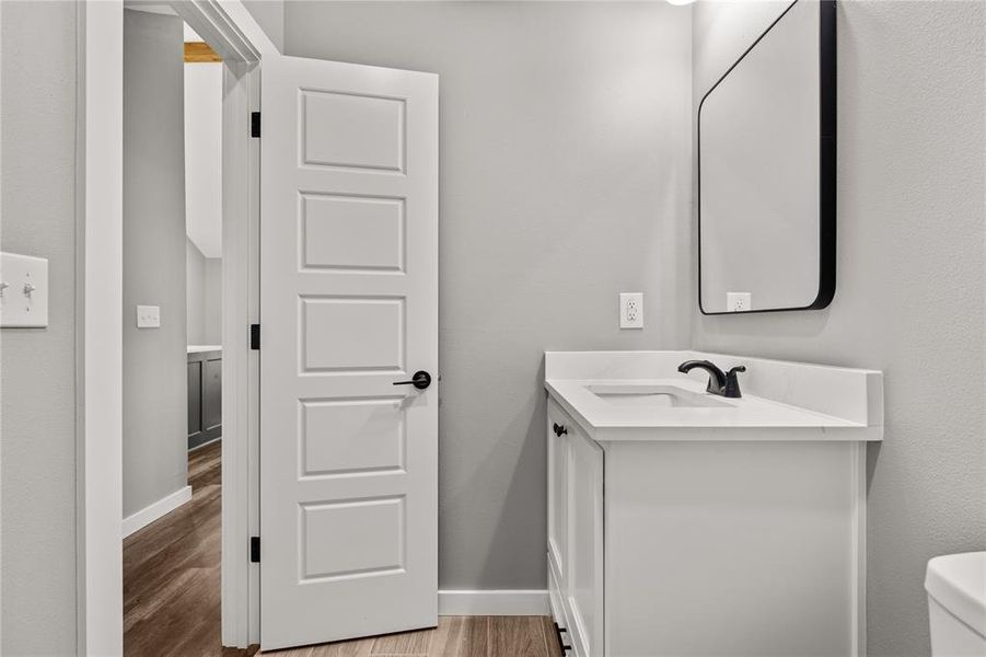 Bathroom featuring vanity and light wood-style flooring
