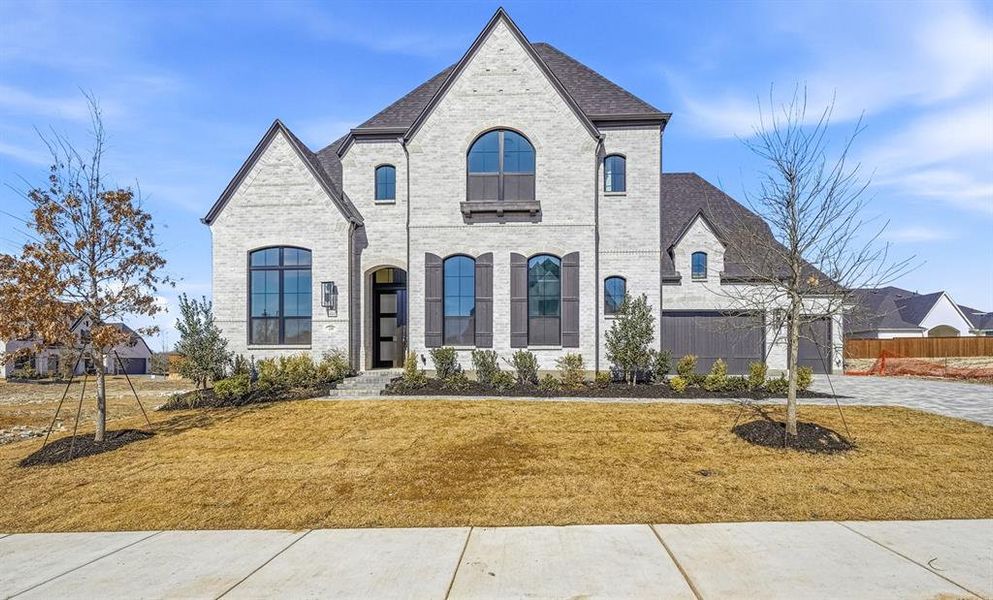 Front exterior of a new home in Mustang Lakes, Celina, TX, highlighting curb appeal (Image 1). Front exterior of a new home in Mustang Lakes, Celina, TX, highlighting curb appeal (Image 1).
