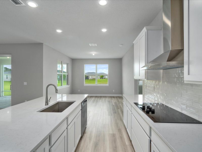 Kitchen in the Coral floorplan at 6295 NW Sweetwood Drive in Brystol at Wylder