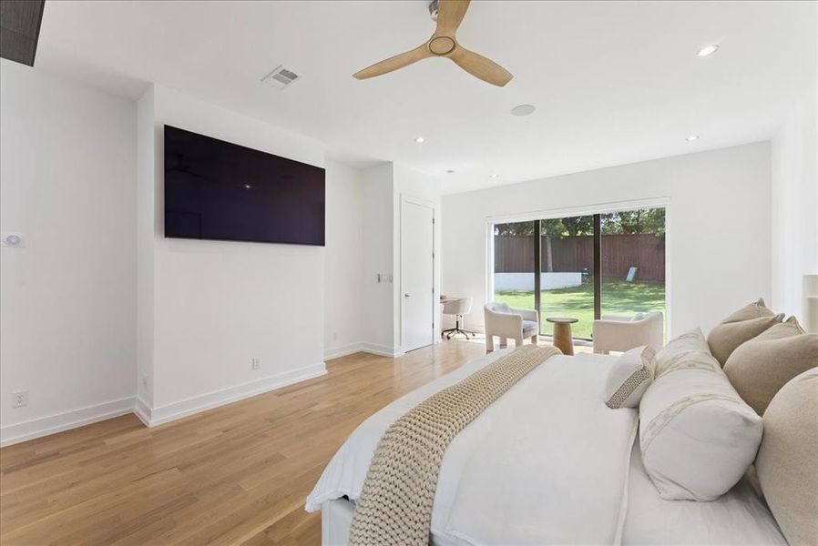 Bedroom featuring wood finished floors, access to outside, a ceiling fan, and recessed lighting