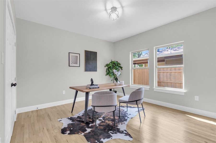Office area with light wood finished floors and baseboards