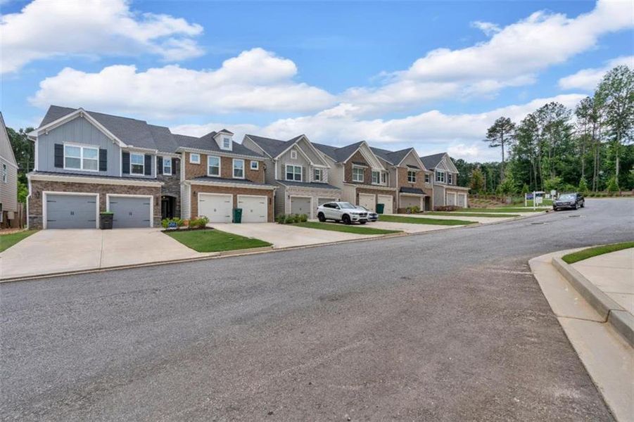 Front exterior of a new home in Park Center Pointe, Austell, GA, highlighting curb appeal (Image 25).
