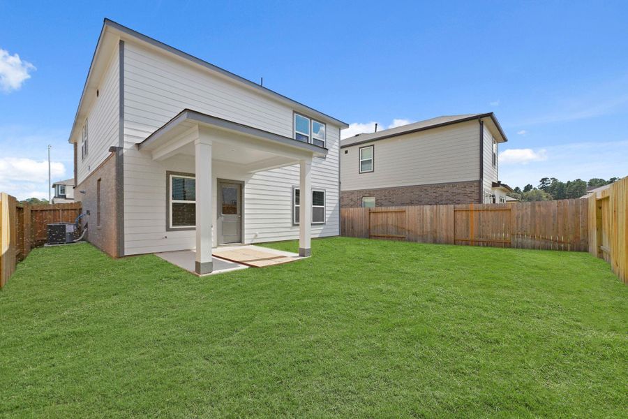 Exterior details and patio area of a home in Lakes at Black Oak, Magnolia (Image 3).