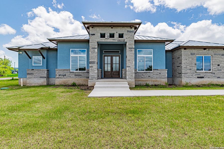 Front exterior of a new home in , Adkins, TX, highlighting curb appeal (Image 25). Front exterior of a new home in , Adkins, TX, highlighting curb appeal (Image 25).