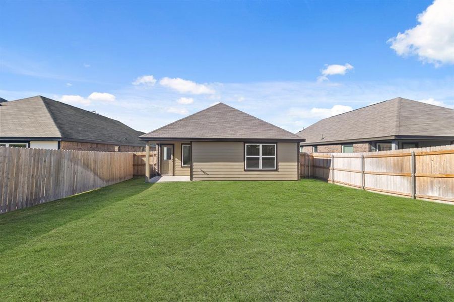 Exterior details and patio area of a home in Christian Meadows, Ennis (Image 2).