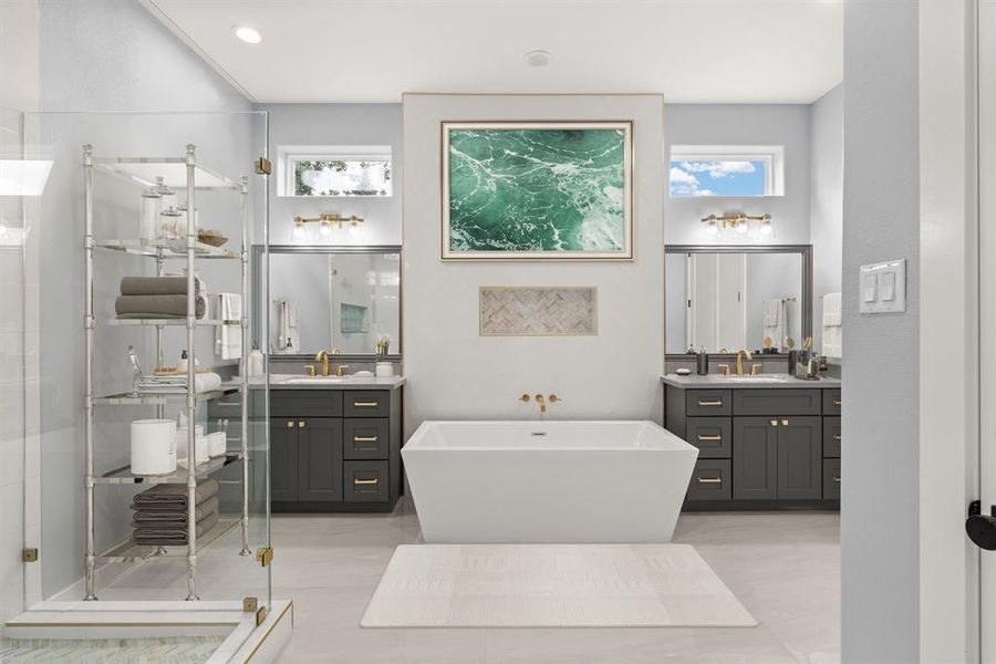 The primary bathroom features double vanities, a walk-in shower, and a standalone bathtub, offering a luxurious and functional space for relaxation and daily routines.