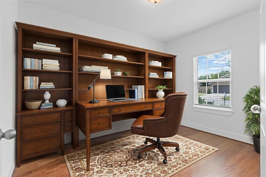 The spacious hallway leads directly into the dedicated study, located at the front of the home. Featuring a large window and soaring ceilings, this private workspace is perfect for remote work, reading, or creative pursuits. *Virtually Staged* **Image Representative of Plan Only and May Vary as Built**. The spacious hallway leads directly into the dedicated study, located at the front of the home. Featuring a large window and soaring ceilings, this private workspace is perfect for remote work, reading, or creative pursuits. *Virtually Staged* **Image Representative of Plan Only and May Vary as Built**.