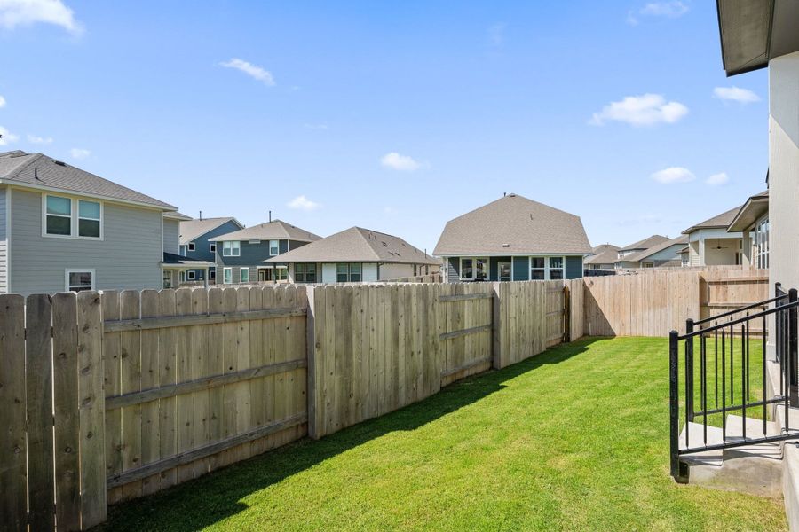 Exterior details and patio area of a home in Lariat, Liberty Hill (Image 4).
