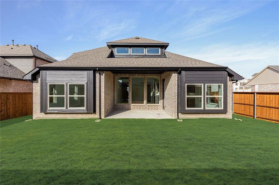 Exterior details and patio area of a home in Creekview Meadows, Pilot Point (Image 2).