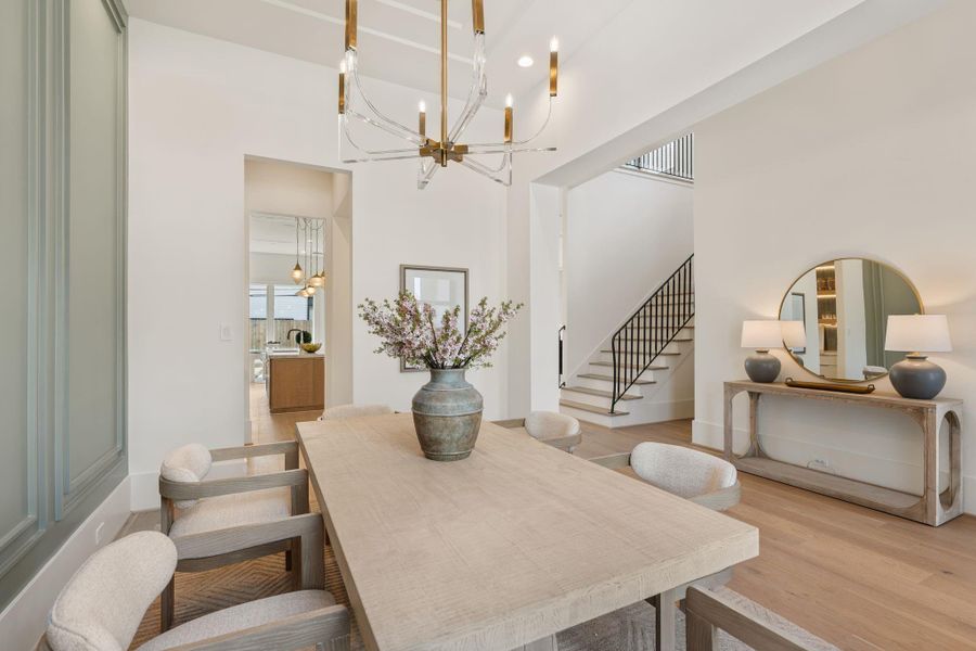 From this perspective, the dining area connects effortlessly to the rest of the home, showcasing the open-concept design and the continuity of high-end finishes throughout.