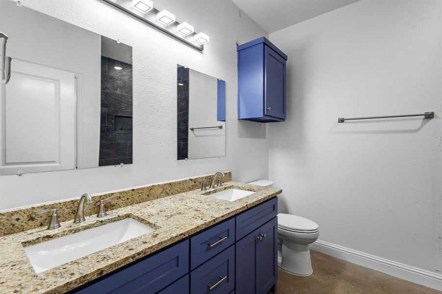 Bathroom featuring toilet and vanity