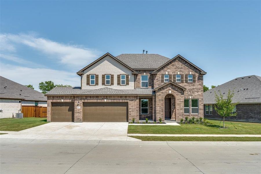 Front exterior of a new home in The Preserve Estates, Justin, TX, highlighting curb appeal (Image 21). Front exterior of a new home in The Preserve Estates, Justin, TX, highlighting curb appeal (Image 21).