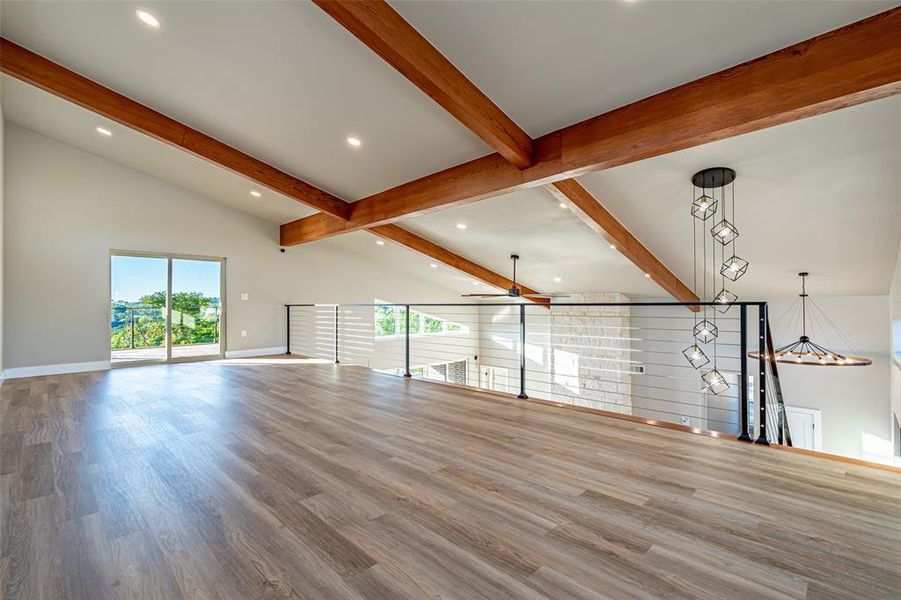Unfurnished living room featuring ceiling fan, wood finished floors, and recessed lighting Unfurnished living room featuring ceiling fan, wood finished floors, and recessed lighting