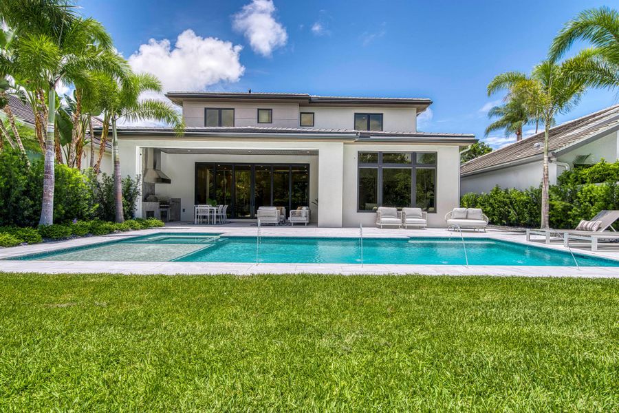 Front exterior of a new home in , Palm Beach Gardens, FL, highlighting curb appeal (Image 2).