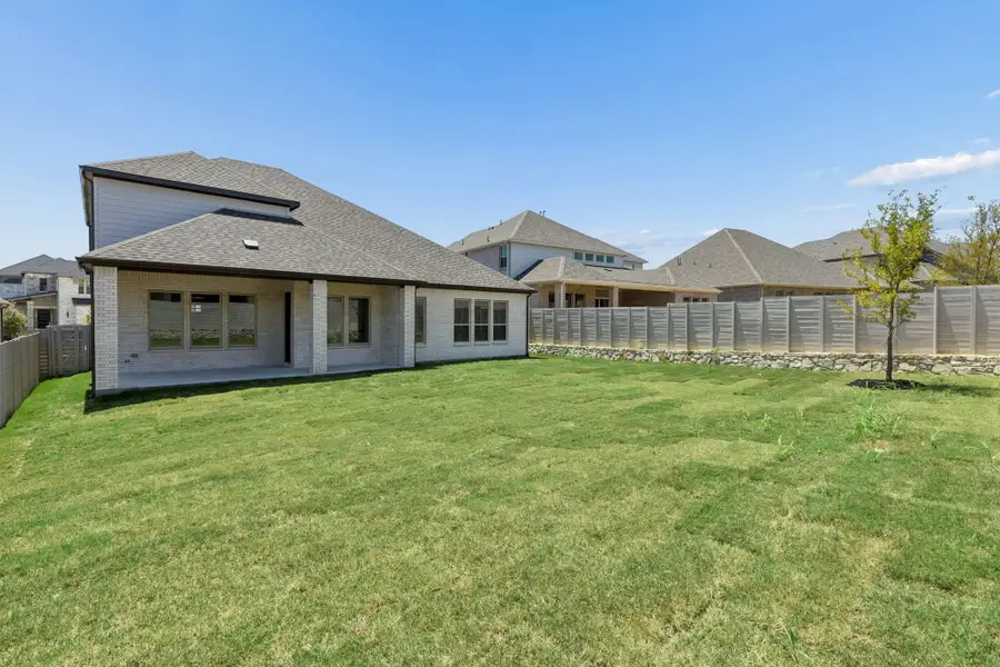 Exterior details and patio area of a home in Painted Tree Lakeside, McKinney (Image 3).