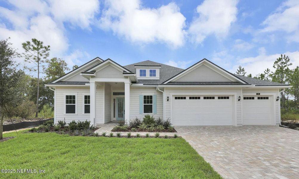 Front exterior of a new home in Hidden Creek at SilverLeaf, St. Augustine, FL, highlighting curb appeal (Image 17).