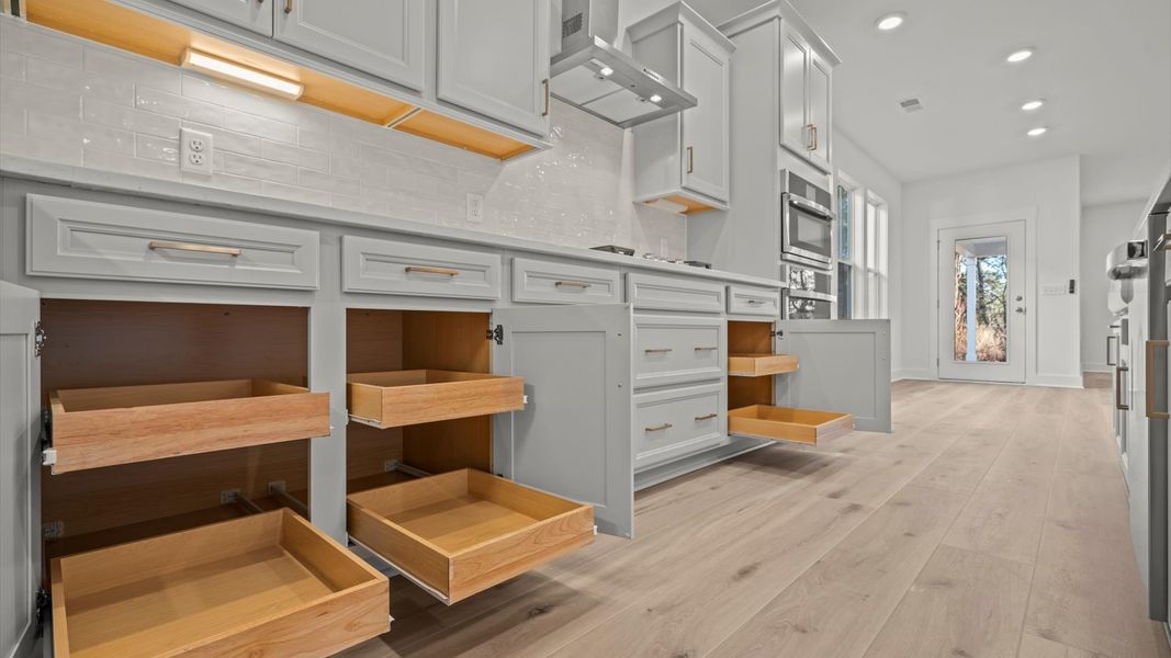 Exclusive kitchen design with large island, pendant lights, and tasteful finishes throughout