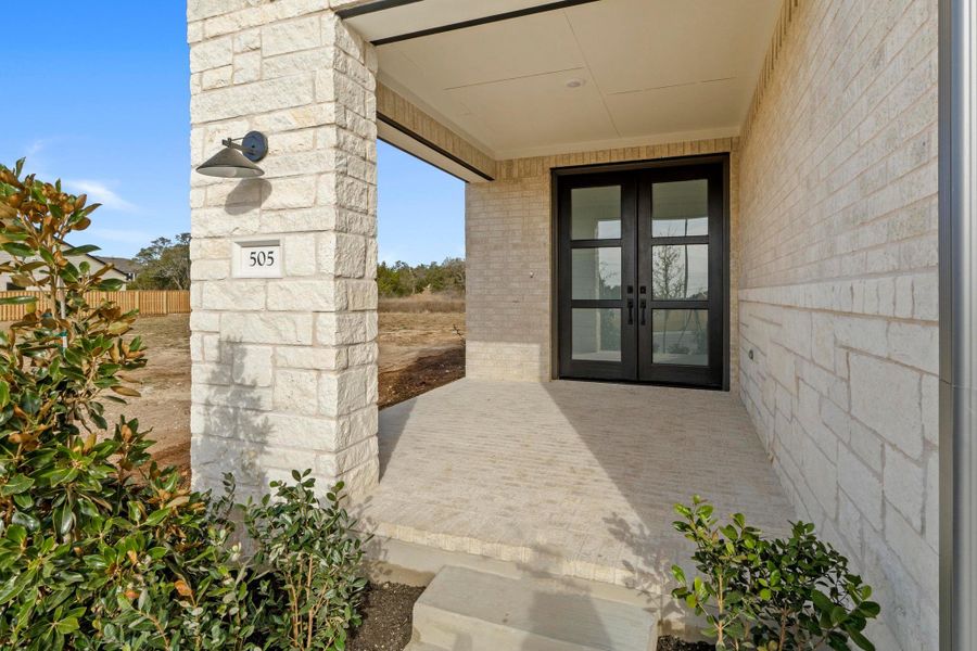 Exterior details and patio area of a home in Parmer Ranch, Georgetown (Image 20).