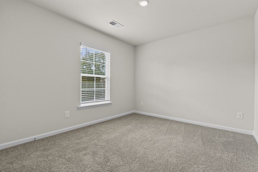 Representative unfurnished interior of a home built from the Cedar A by McGuinn Homes in Forts Ridge, Pelion (Image 24).