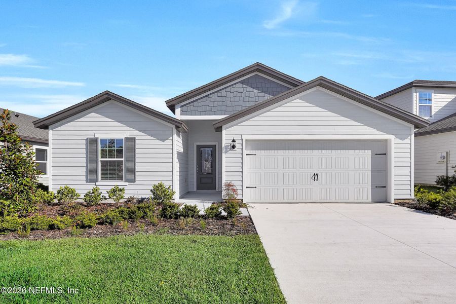 Front exterior of a new home in Westport Landing, Jacksonville, FL, highlighting curb appeal (Image 1). Front exterior of a new home in Westport Landing, Jacksonville, FL, highlighting curb appeal (Image 1).