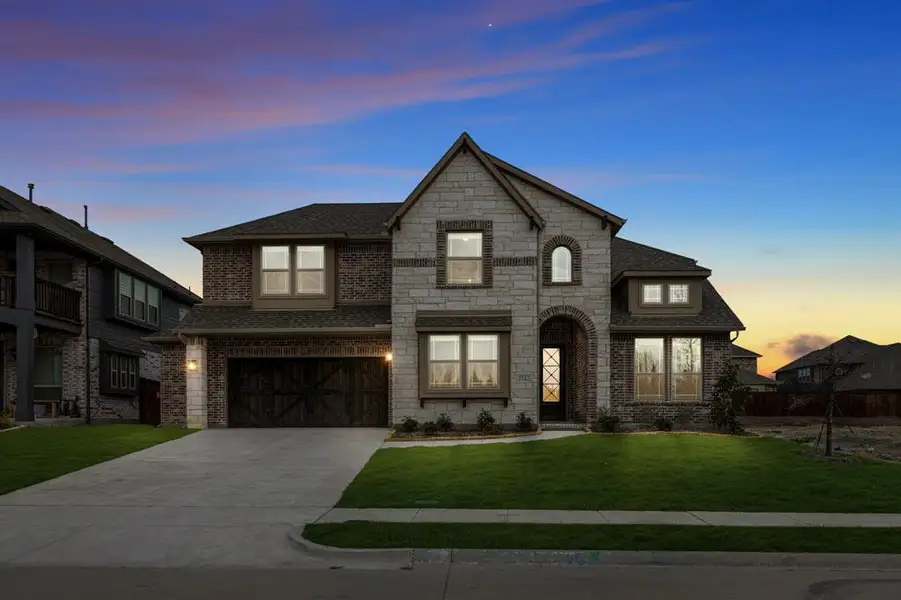Front exterior of a new home in Terracina, Rockwall, TX, highlighting curb appeal (Image 21).