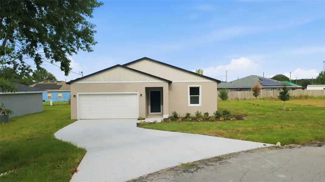 Front exterior of a new home in , Ocala, FL, highlighting curb appeal (Image 2). Front exterior of a new home in , Ocala, FL, highlighting curb appeal (Image 2).