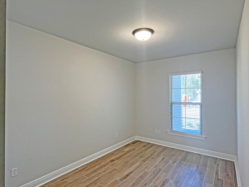Spacious, unfurnished interior of a new home in Bird Song at Hammock Bay, Freeport (Image 25).
