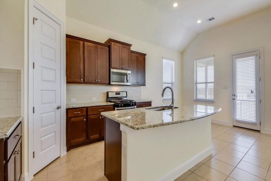 Representative furnished interior of a home built from the Oaks 1596 by Brohn Homes in Oaks at San Gabriel, Georgetown (Image 5).
