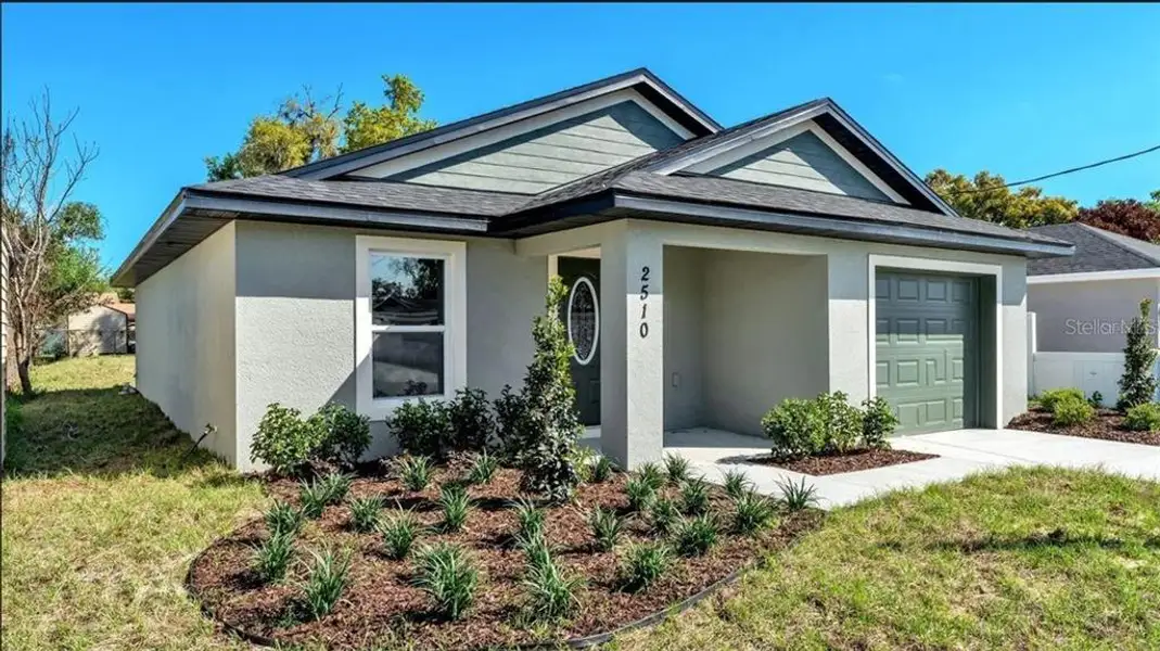 Front exterior of a new home in , Winter Haven, FL, highlighting curb appeal (Image 2). Front exterior of a new home in , Winter Haven, FL, highlighting curb appeal (Image 2).