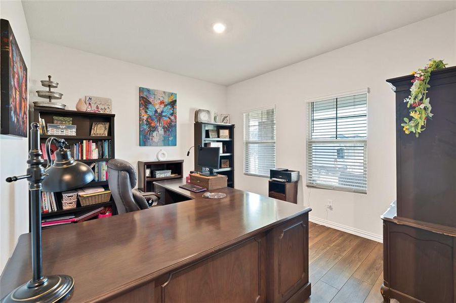 Home office with baseboards and dark wood-style floors