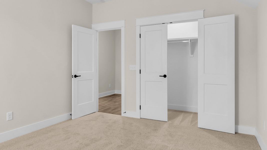Carpeted secondary bedroom (Representative of finished home)