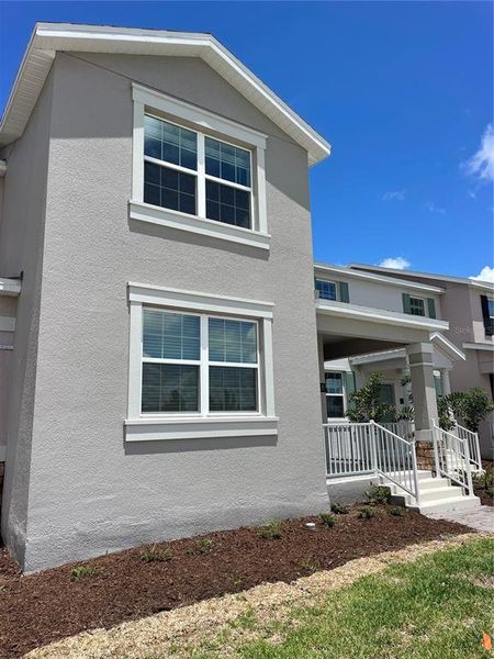 Front exterior of a new home in , Kissimmee, FL, highlighting curb appeal (Image 16). Front exterior of a new home in , Kissimmee, FL, highlighting curb appeal (Image 16).