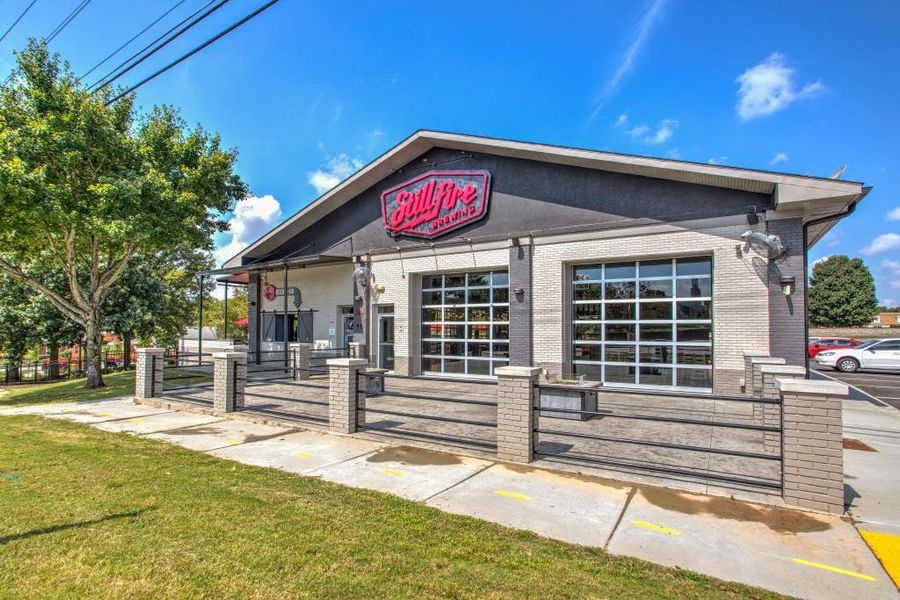 Front exterior of a new home in , Suwanee, GA, highlighting curb appeal (Image 2).