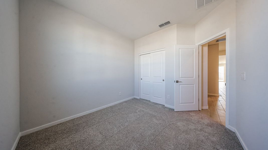A hallway with white doors. A hallway with white doors.