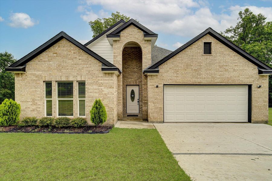 Front exterior of a new home in , Kenefick, TX, highlighting curb appeal (Image 2).